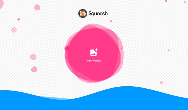 Squoosh image optimization tool interface with pink circular button to drop or paste images.